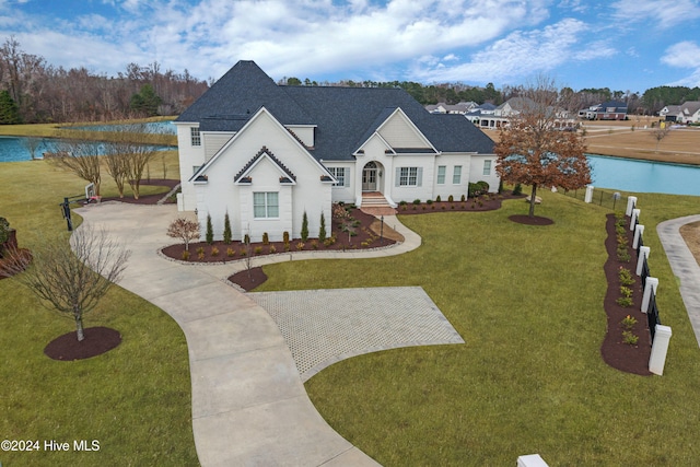 view of front of property featuring a water view and a front yard