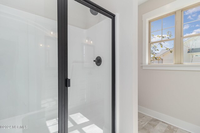 bathroom with an enclosed shower