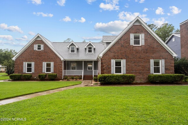 view of front of house with a front lawn and covered porch