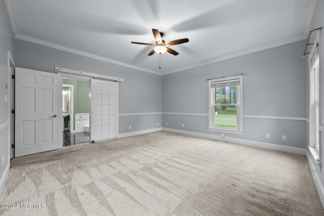 empty room with light carpet, ornamental molding, and ceiling fan