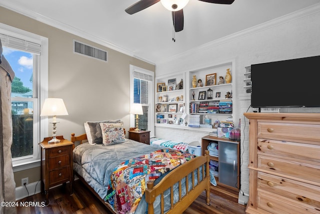 bedroom featuring ceiling fan, dark wood-type flooring, visible vents, and crown molding