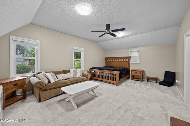 bedroom featuring light carpet, vaulted ceiling, and multiple windows