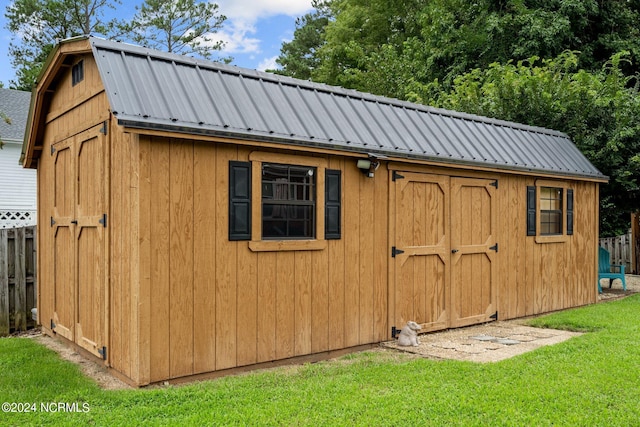 view of shed with fence