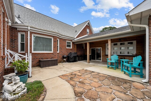view of patio with a grill