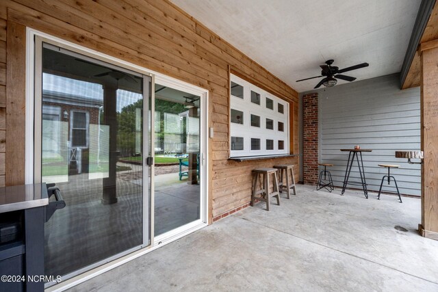 view of patio featuring ceiling fan