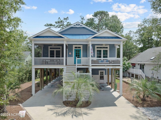 beach home with a carport and a porch