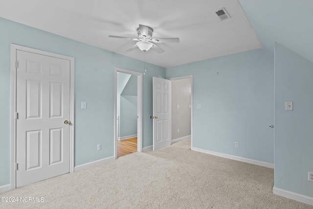 unfurnished bedroom featuring carpet and ceiling fan