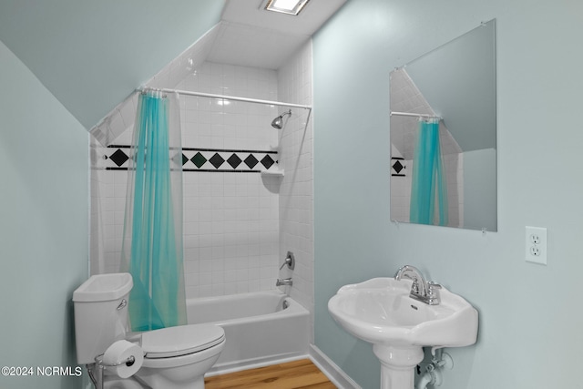 full bathroom with wood-type flooring, shower / bathtub combination with curtain, toilet, and sink