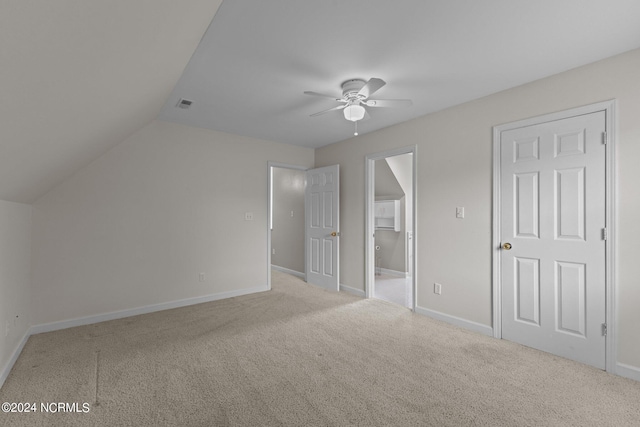 bonus room featuring ceiling fan, vaulted ceiling, and carpet flooring