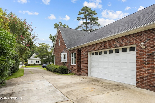 view of property exterior featuring a garage