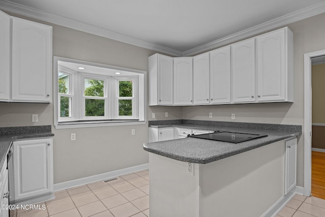 kitchen featuring light hardwood / wood-style flooring, ornamental molding, kitchen peninsula, and white cabinetry