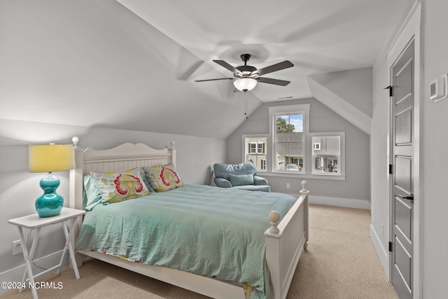 bedroom featuring lofted ceiling, ceiling fan, carpet floors, and baseboards