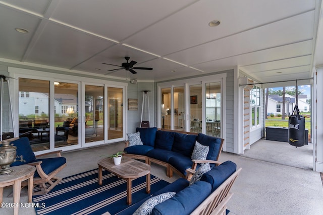 sunroom with a ceiling fan