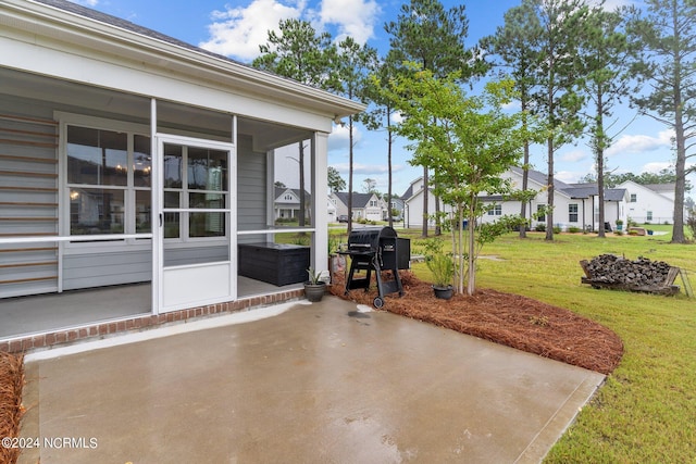 view of patio / terrace featuring a grill and a residential view