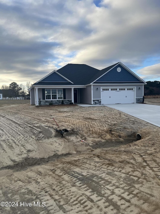 single story home with a garage