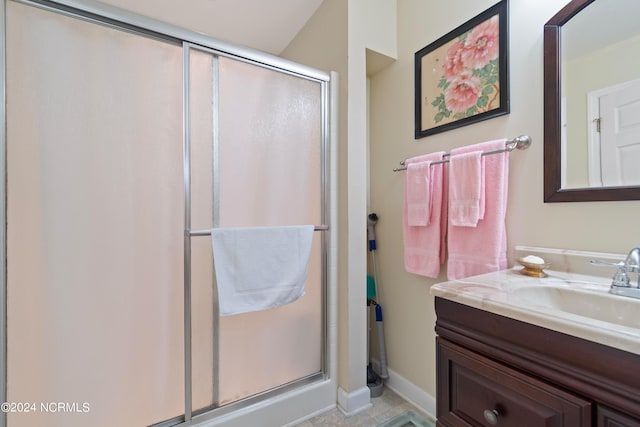 bathroom featuring vanity and walk in shower