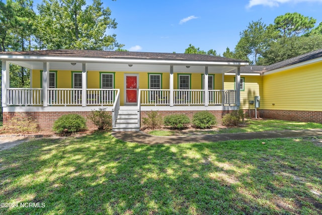 single story home with covered porch and a front lawn