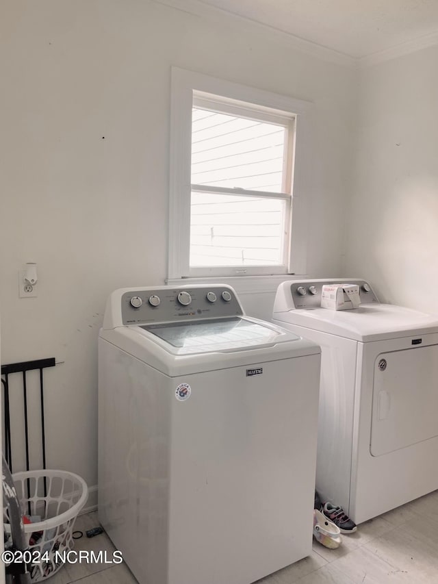 laundry area featuring washing machine and clothes dryer