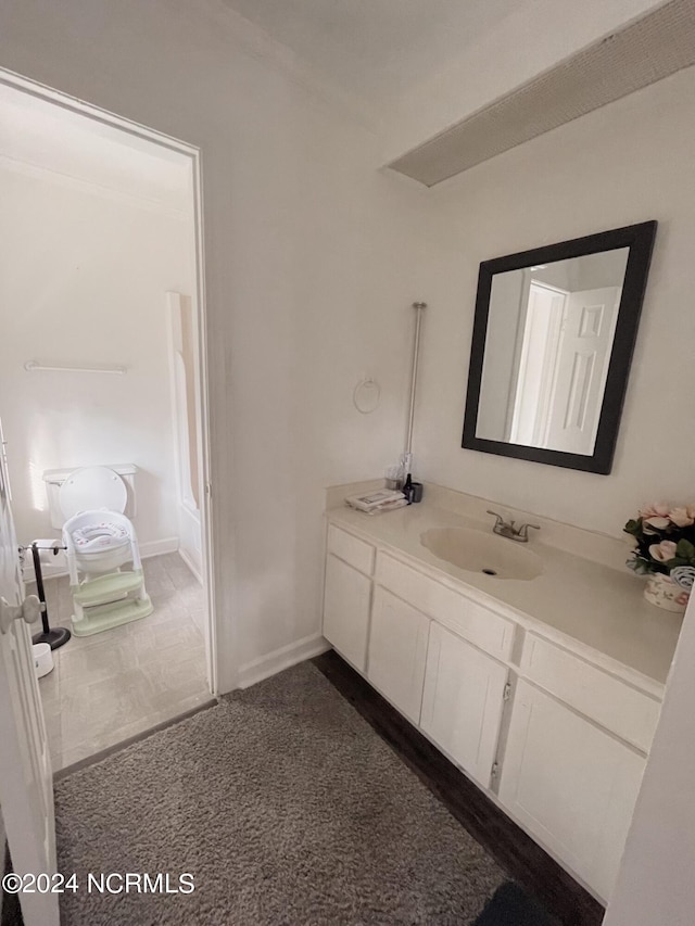 bathroom with tile patterned flooring and vanity