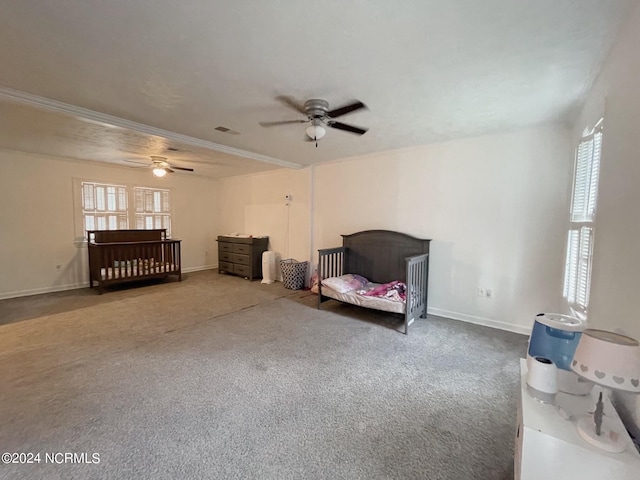 carpeted bedroom with ceiling fan