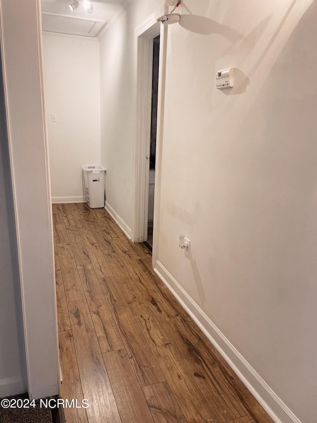 hall with hardwood / wood-style flooring