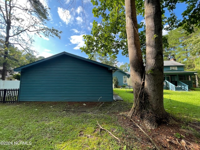 view of home's exterior featuring a lawn