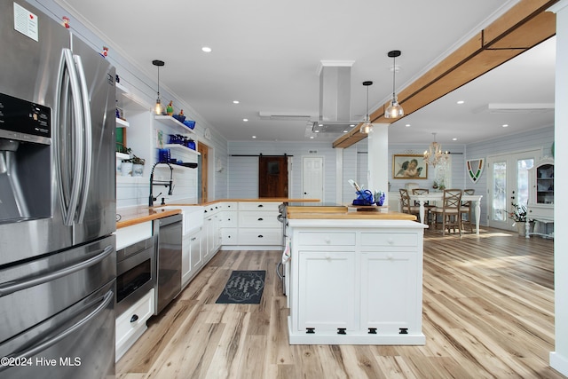 511 N A St, Bridgeton, NC 28519 - kitchen with appliances with stainless steel finishes, a sink, a barn door, butcher block countertops, and light wood-style floors
