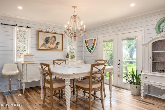 511 N A St, Bridgeton, NC 28519 - dining room featuring a chandelier, light wood finished floors, wooden walls, recessed lighting, and ornamental molding