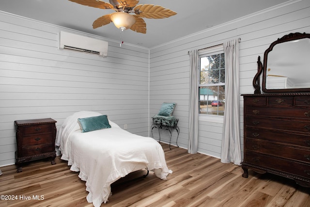 511 N A St, Bridgeton, NC 28519 - bedroom featuring a wall mounted AC, crown molding, light wood-style floors, wood walls, and ceiling fan