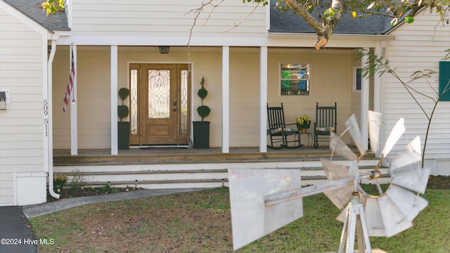 511 N A St, Bridgeton, NC 28519 - view of exterior entry with covered porch and roof with shingles