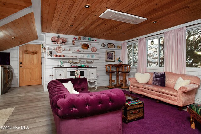 511 N A St, Bridgeton, NC 28519 - living room with wooden ceiling, washer / dryer, wood finished floors, wood walls, and vaulted ceiling