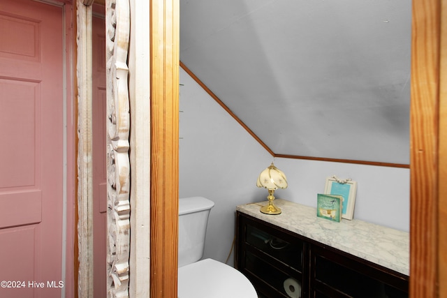 511 N A St, Bridgeton, NC 28519 - bathroom featuring vaulted ceiling and toilet