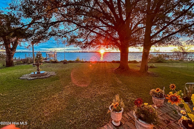 511 N A St, Bridgeton, NC 28519 - yard at dusk featuring a water view and a yard