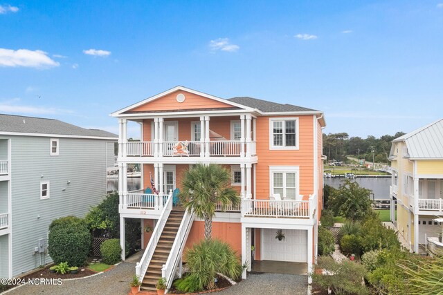 view of front of house featuring a balcony and a garage