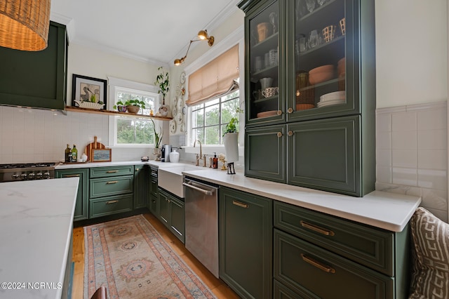 kitchen with sink, dishwasher, stove, light stone counters, and light hardwood / wood-style floors