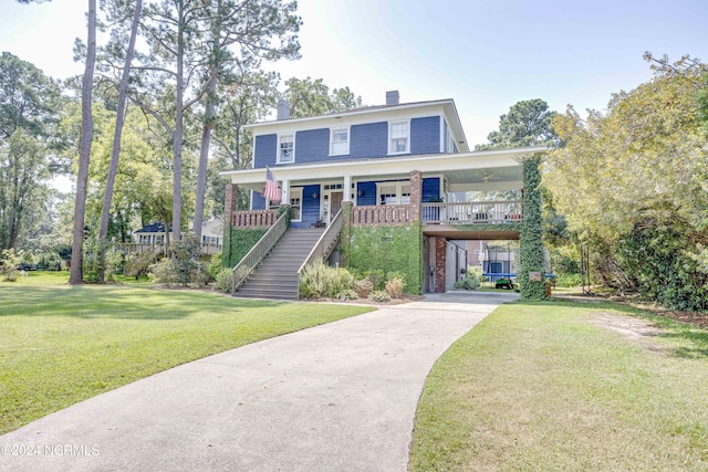 view of front of house featuring covered porch and a front lawn