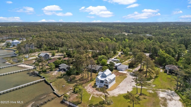 aerial view featuring a wooded view
