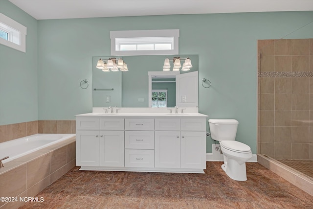 full bathroom with vanity, plus walk in shower, plenty of natural light, and toilet