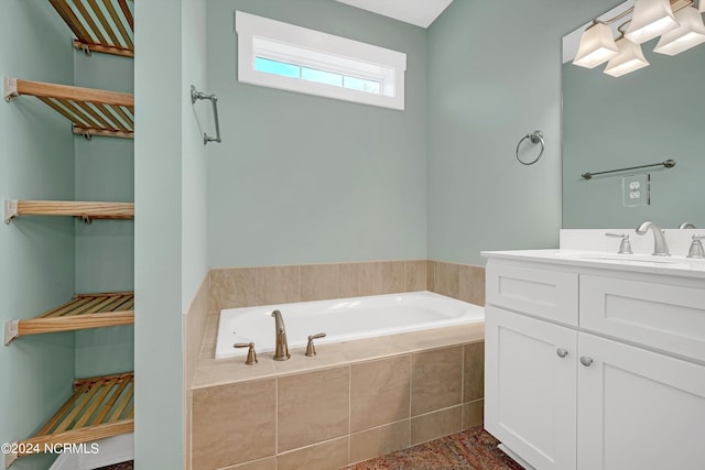 bathroom with vanity and a relaxing tiled tub