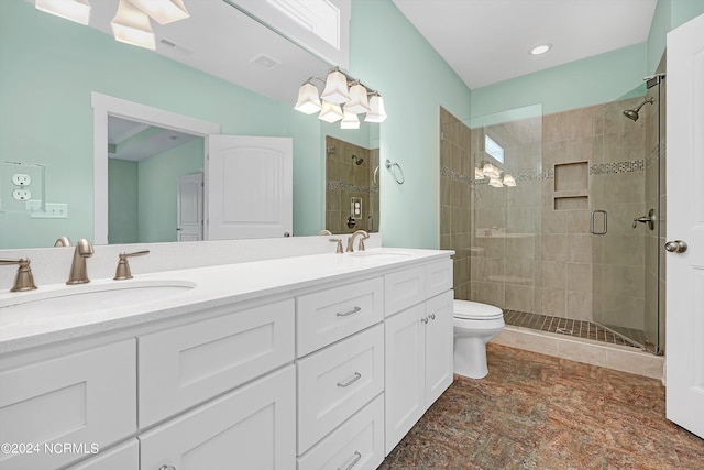 bathroom with walk in shower, vanity, and toilet