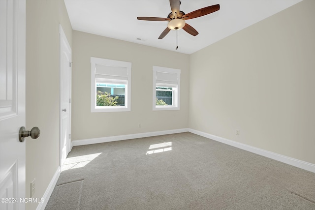 unfurnished room featuring carpet floors and ceiling fan