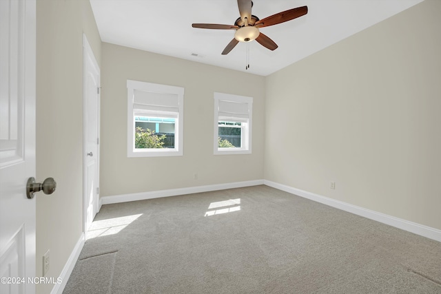 5972 Gray Squirrel Path, Southport, NC 28461 - carpeted spare room featuring ceiling fan and baseboards