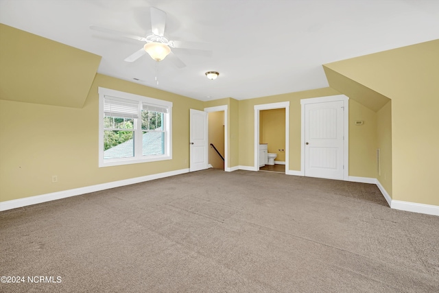 bonus room with carpet and ceiling fan