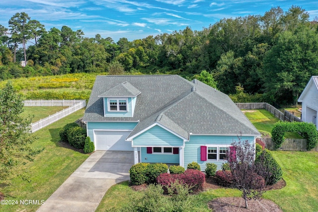 5972 Gray Squirrel Path, Southport, NC 28461 - view of front of home with driveway, a garage, and roof with shingles