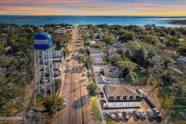 aerial view at dusk with a water view