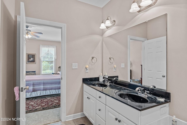 bathroom featuring ceiling fan, tile patterned floors, and double vanity