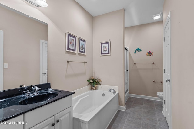 bathroom with toilet, a bathing tub, vanity, and tile patterned flooring