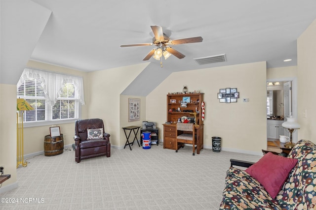 sitting room featuring carpet flooring, vaulted ceiling, and ceiling fan