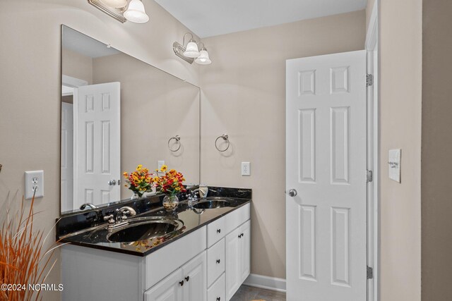 bathroom with dual vanity