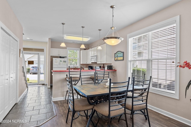 dining room featuring dark hardwood / wood-style flooring